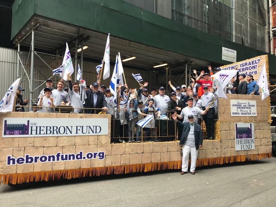Hebron Fund supporters enjoy the parade from the Hebron Fund float